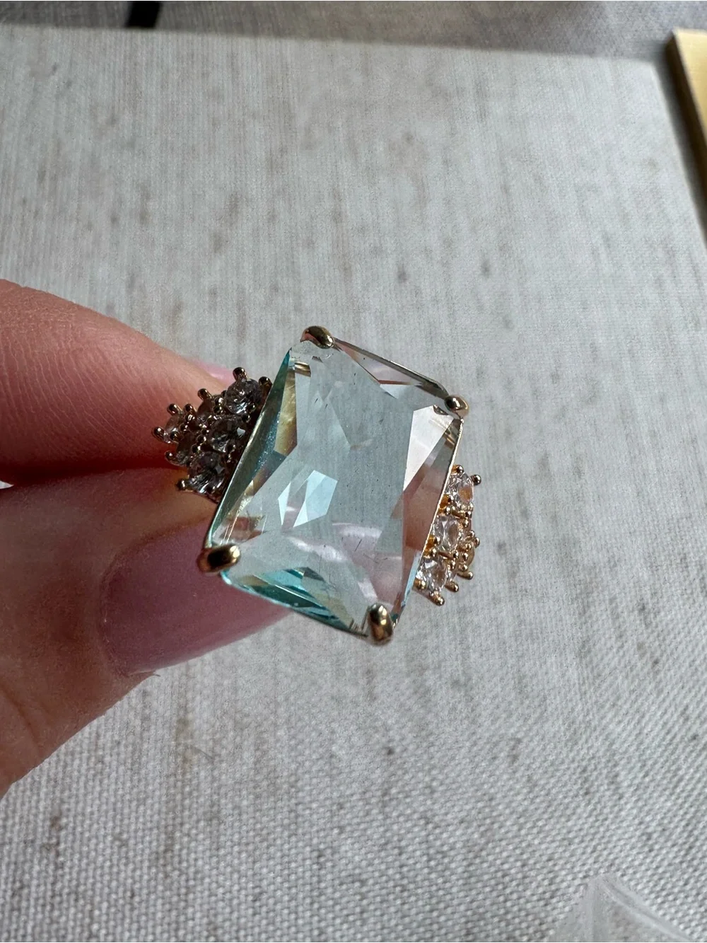 Stunning gold tone ring with blue crystal